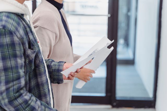 two people holding applications